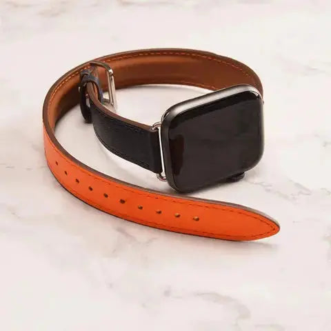 Double Tour Leather Bracelet for Apple Watch with striking orange and black design, showcasing stylish equestrian feel.