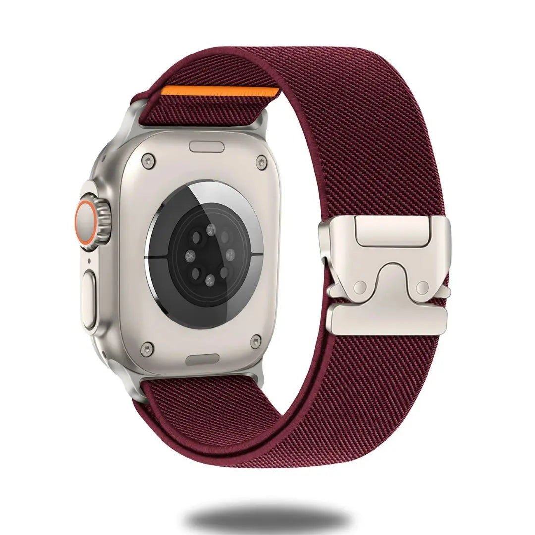 Apple Watch with burgundy stretchy nylon band and titanium parachute clasp for secure fit.