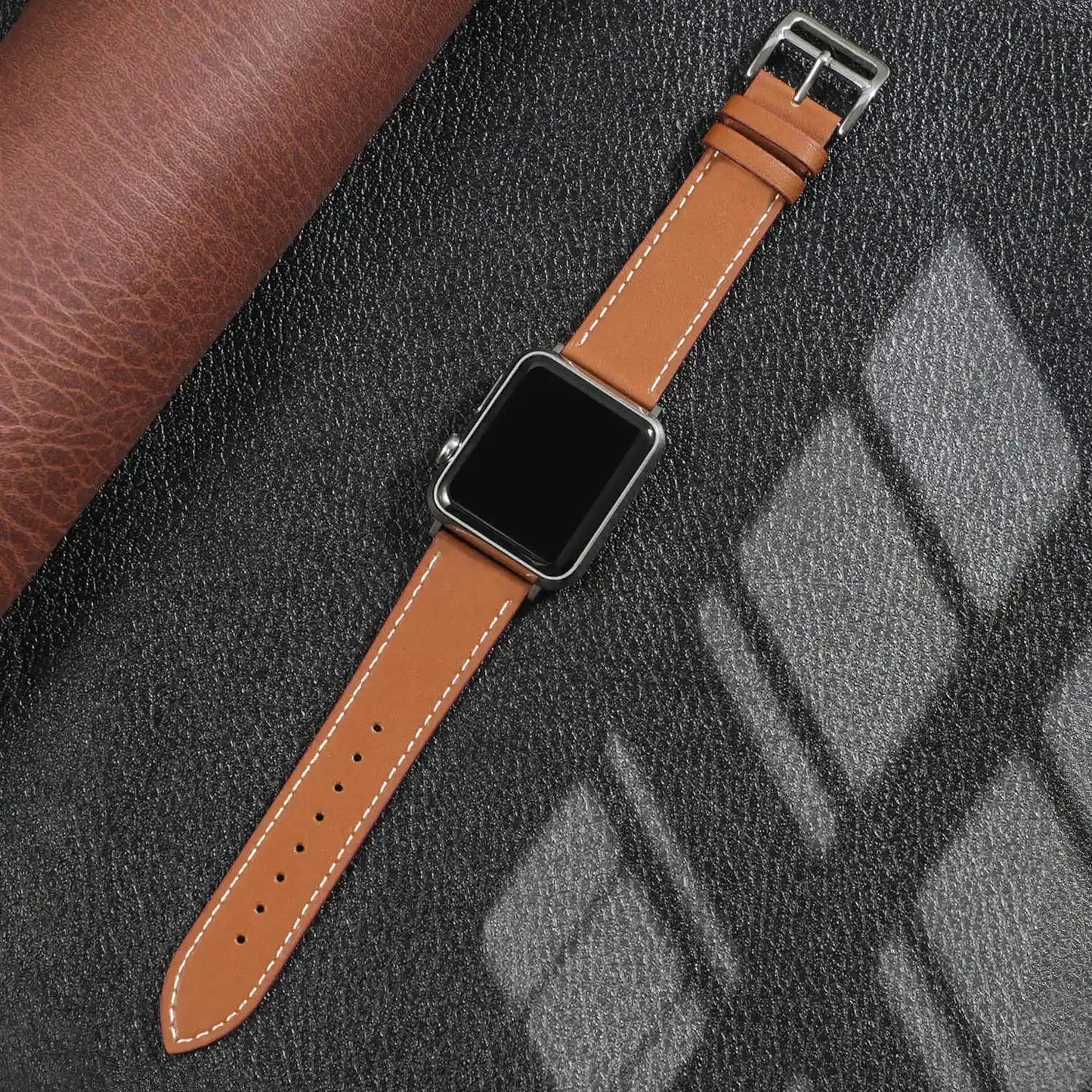 Classic single tour leather strap for Apple Watch, durable vegetable-tanned leather with stainless steel adapter.