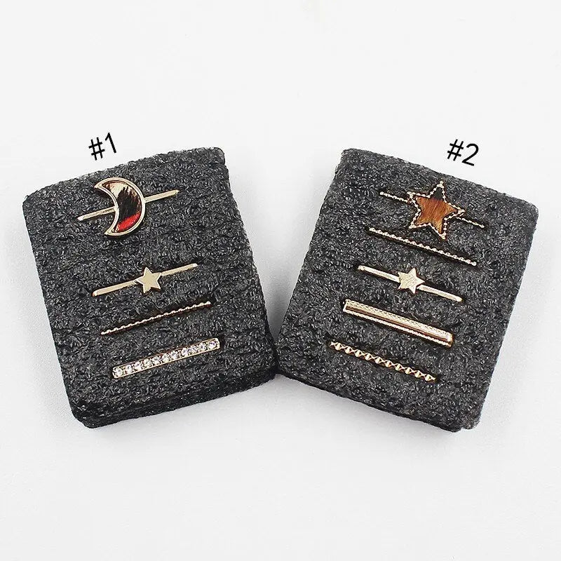 Decorative jewelry rings for watch bands featuring moon and star designs in polished gold with bling crystals.