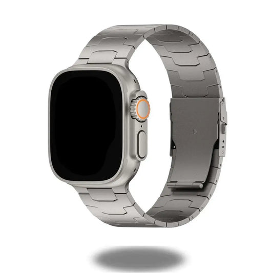 Masculine titanium alloy band for Apple Watch, featuring a satin-brushed finish and secure folding buckle, ideal accessory.