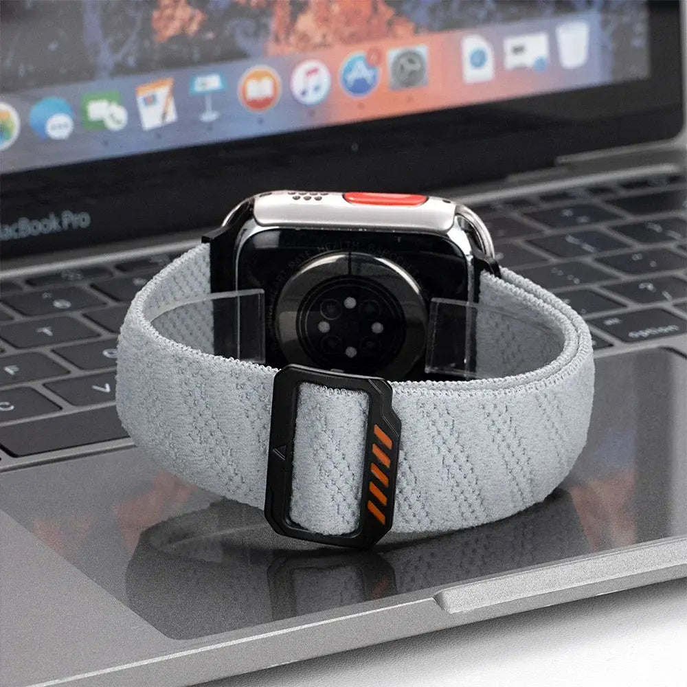 Dennis stretch elastic band on a laptop, showcasing adjustable clasp and soft nylon for comfort and style.