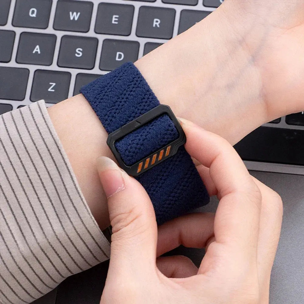 Close-up of Dennis, The Stretchy Elastic Band in navy on wrist, showcasing adjustable clasp for custom fit.