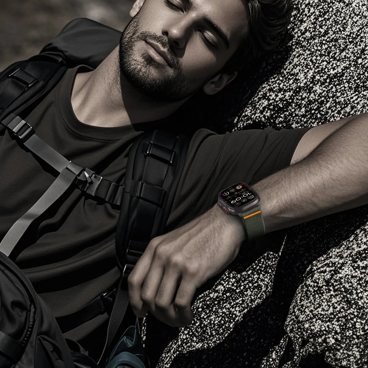 Man wearing Apple Watch with Enzo Stretchy Loop Band on outdoor adventure, showcasing modern comfort and style.