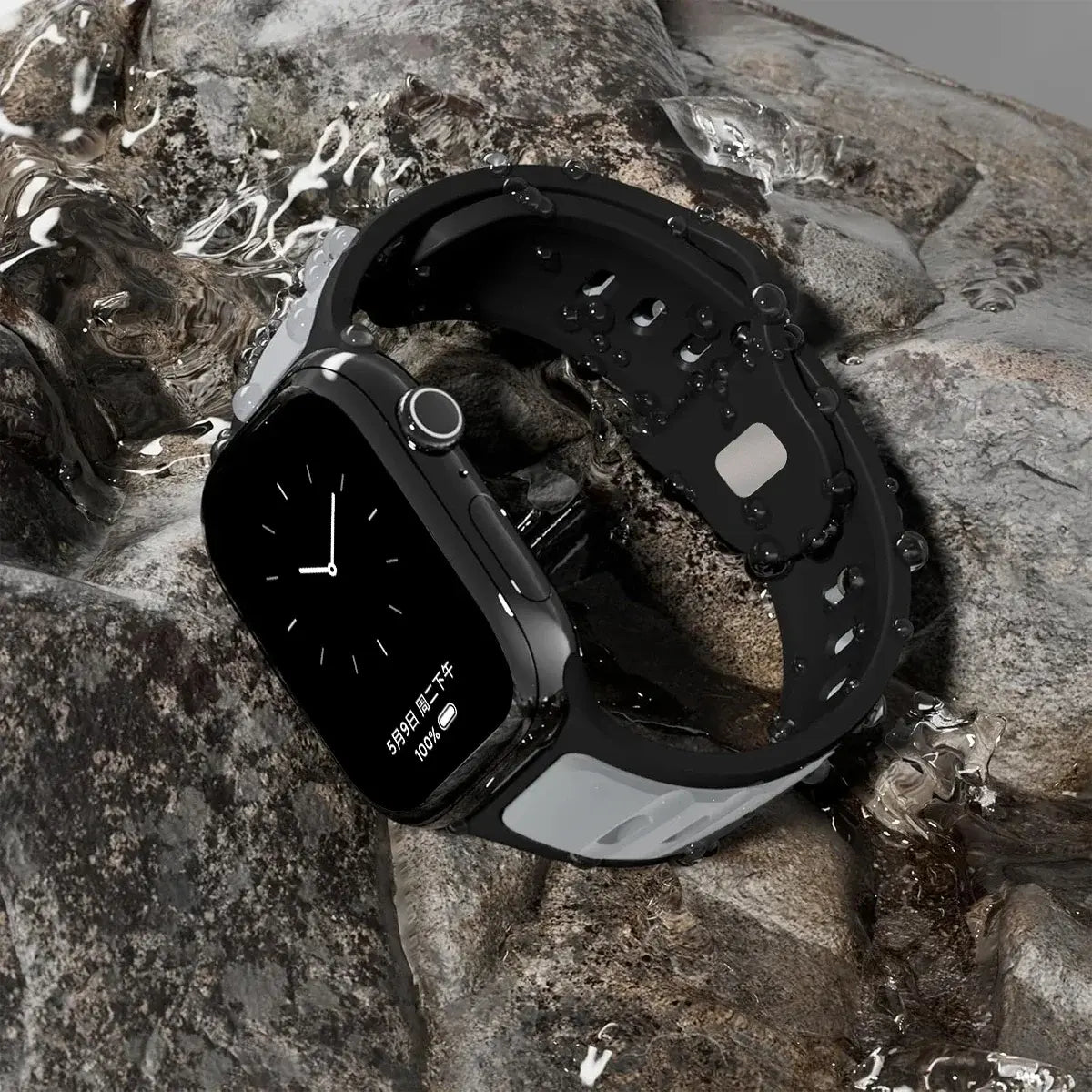Trendy Rugged Silicon Dual Tone Sports Band on Apple Watch, showcasing durability and water resistance on a rocky surface.