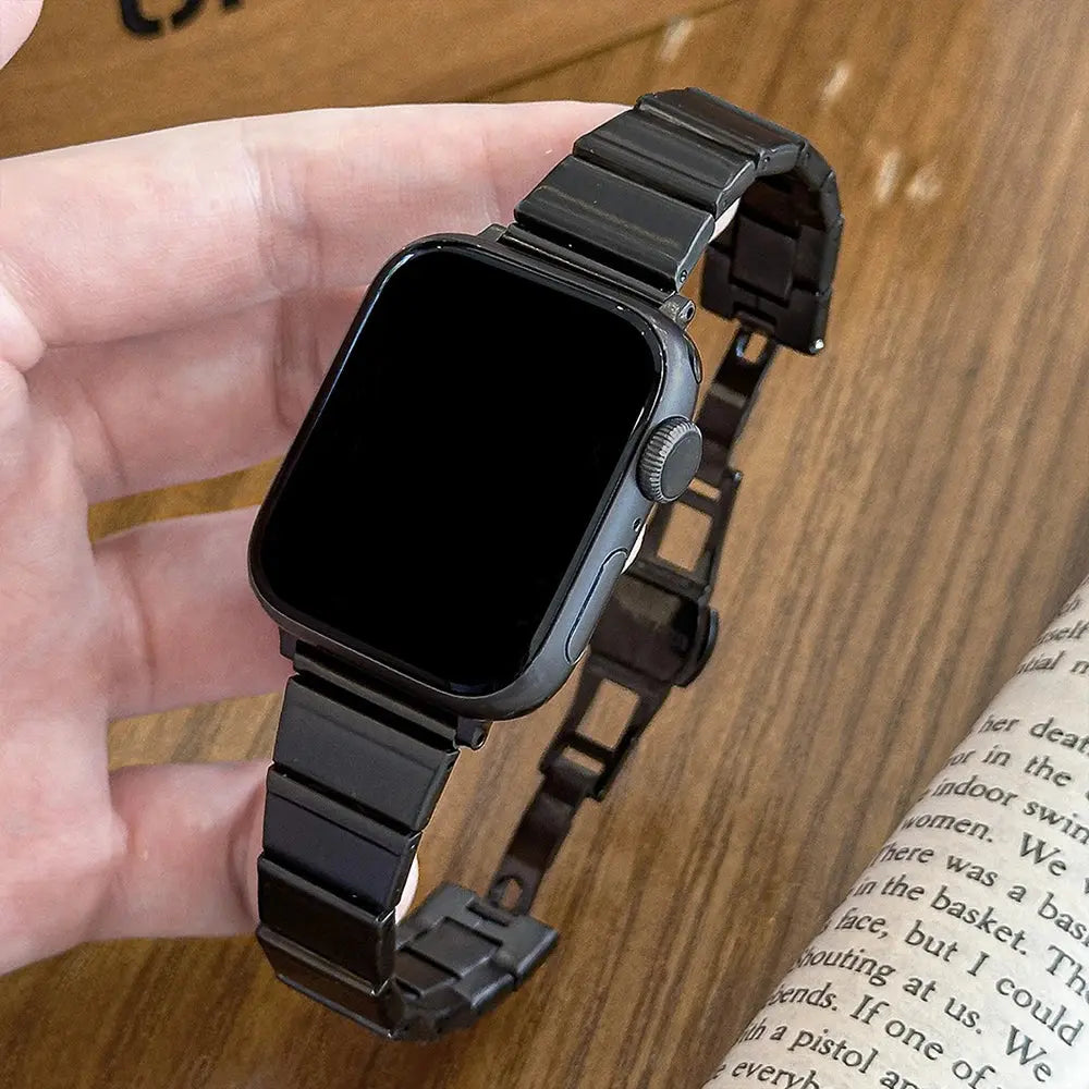 Dina metal bracelet for Apple Watch, stylish stainless steel strap in black, elegant design for women, adjustable fit.