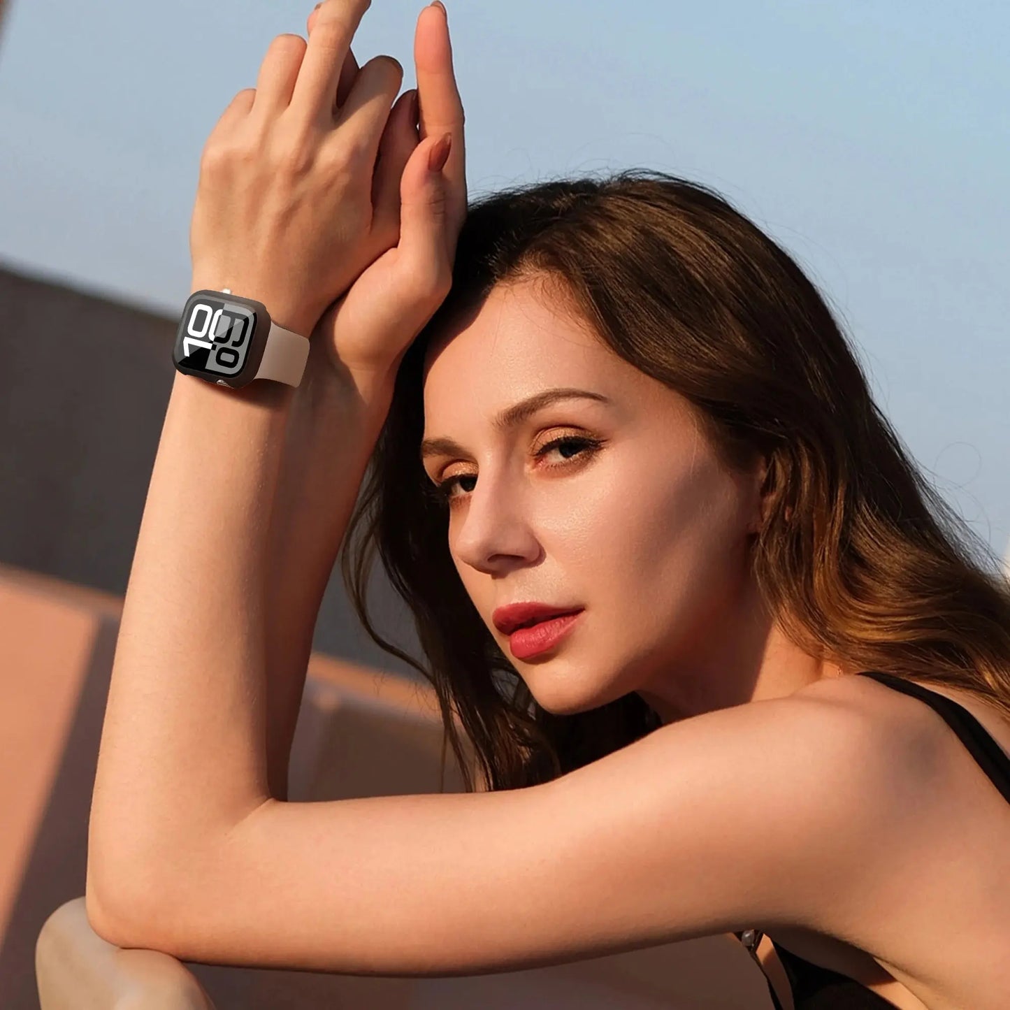 Woman wearing a Series 10 smartwatch with a stylish protective case and HD glass, showcasing its clarity and sleek design.