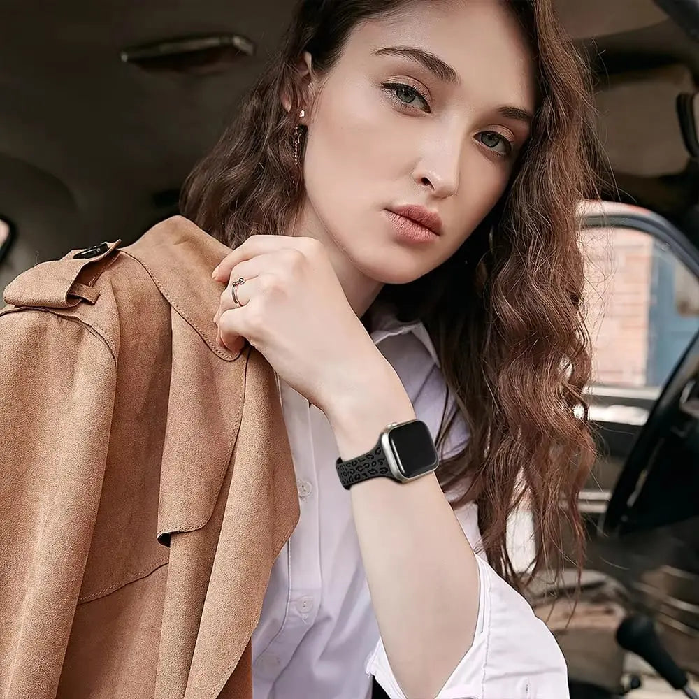 Stylish woman wearing engraved slim silicon band on Apple Watch, showcasing its unique design and elegance.