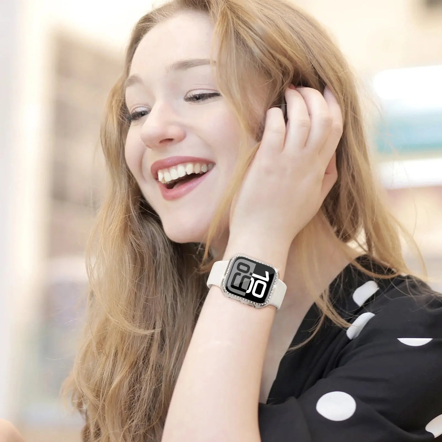 Smiling woman showcasing a rhinestone case for Series 10 watch, featuring stylish design and protective glass.