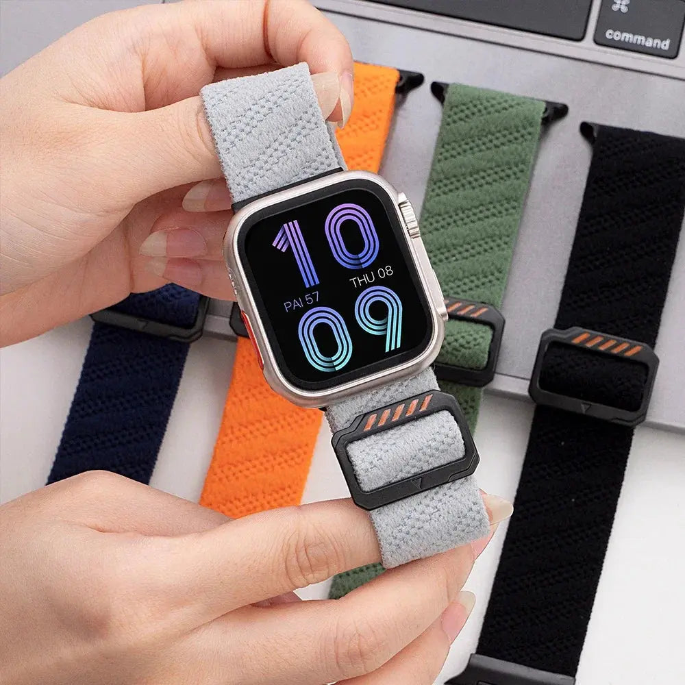 Woman wearing Dennis, The Stretchy Elastic Band in gray, showcasing its adjustable clasp and colorful options.