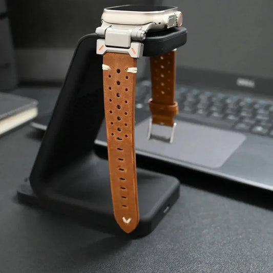 Armor designed leather band for Apple Watch on a stand, showcasing luxury and rugged style with breathable holes.