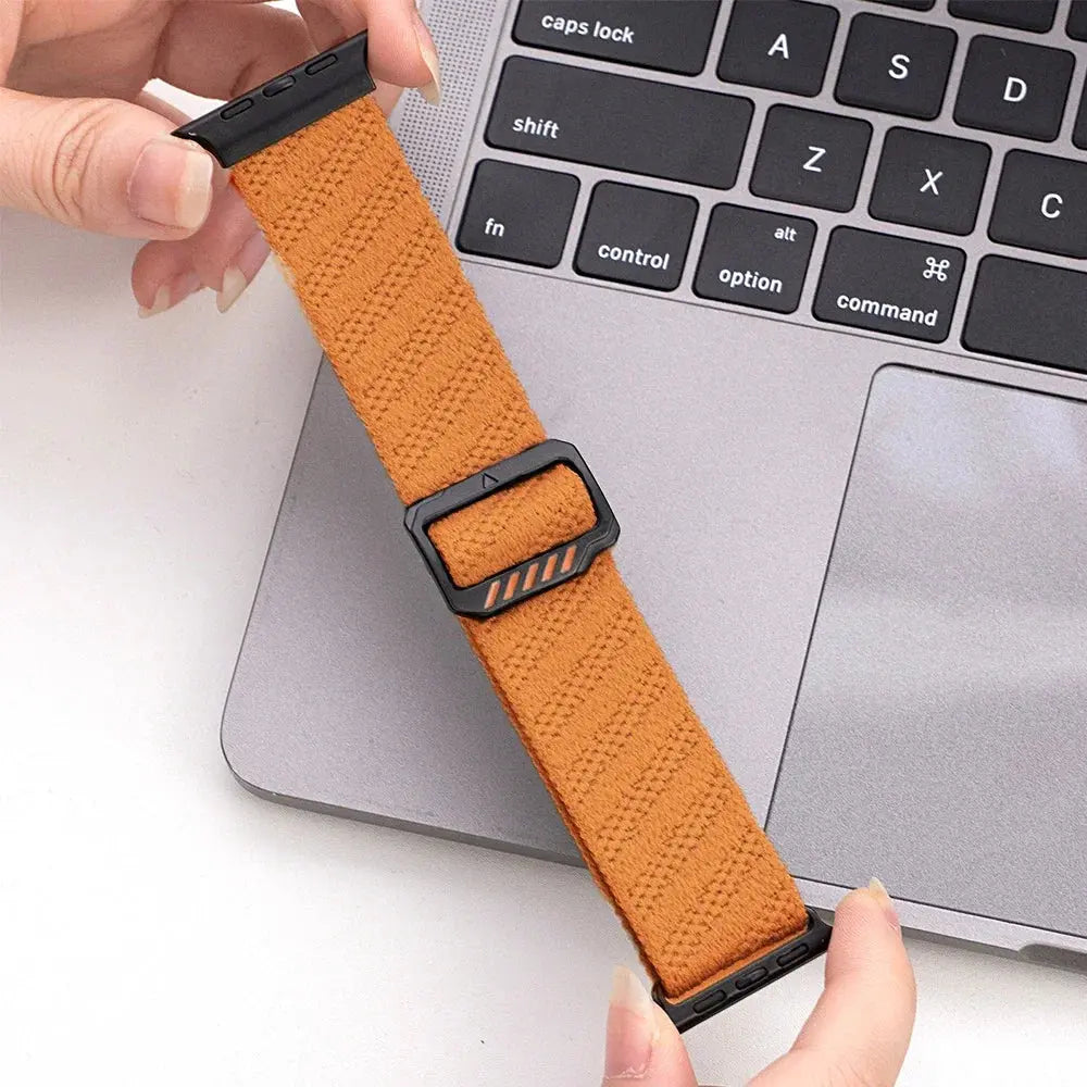 Dennis, The Stretchy Elastic Band in orange, showcasing adjustable clasp and skin-friendly nylon material.