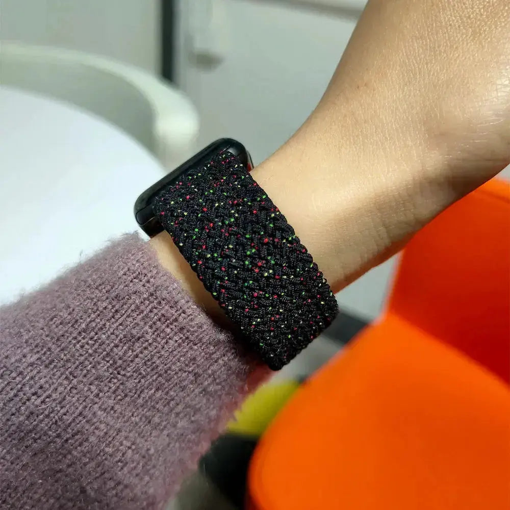 Braided Solo Loop Band for Apple Watch in black and red, worn on wrist, highlighting style and comfort for everyday wear.