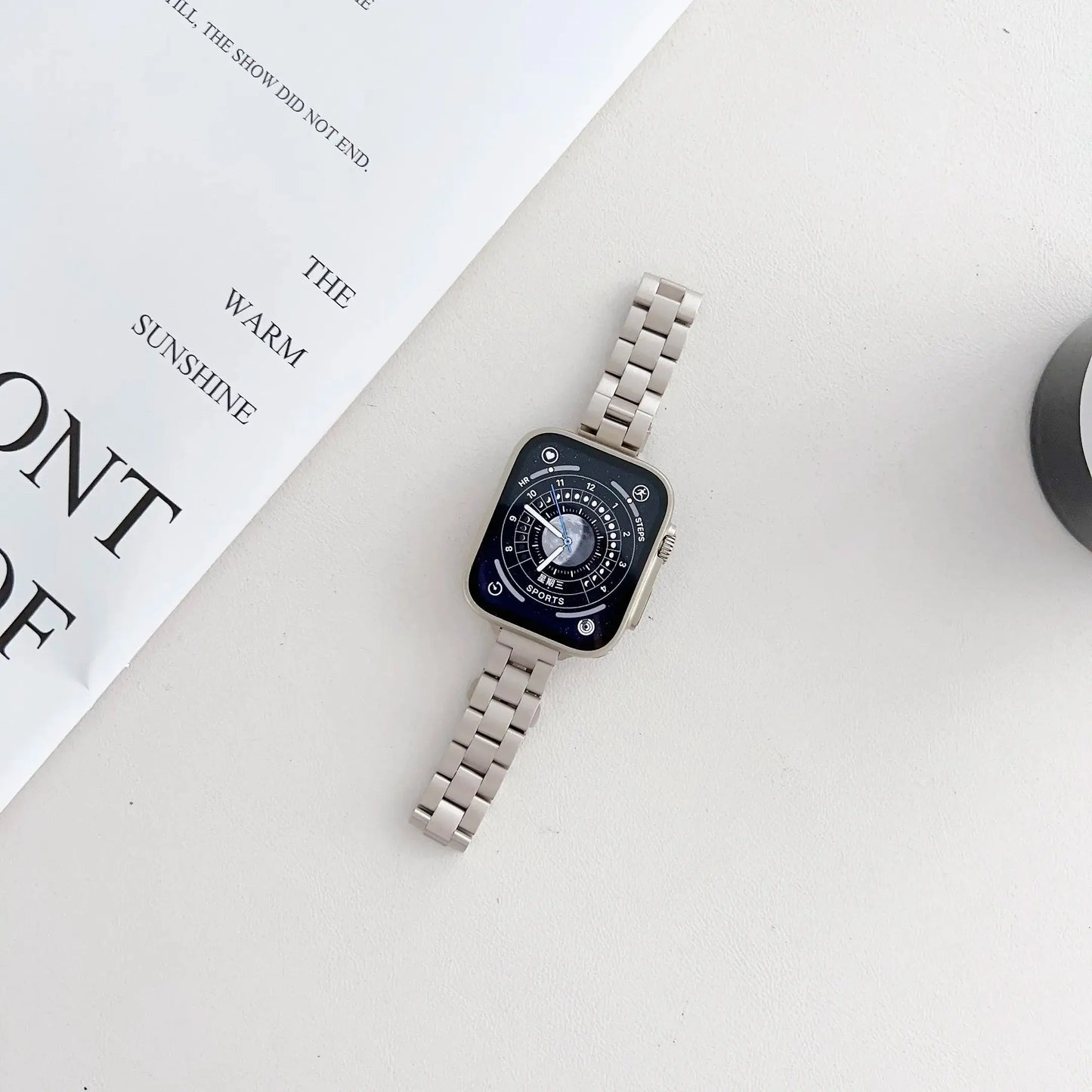 Luxury starlight stainless steel bracelet for Apple Watch in a stylish setup, perfect for everyday elegance.