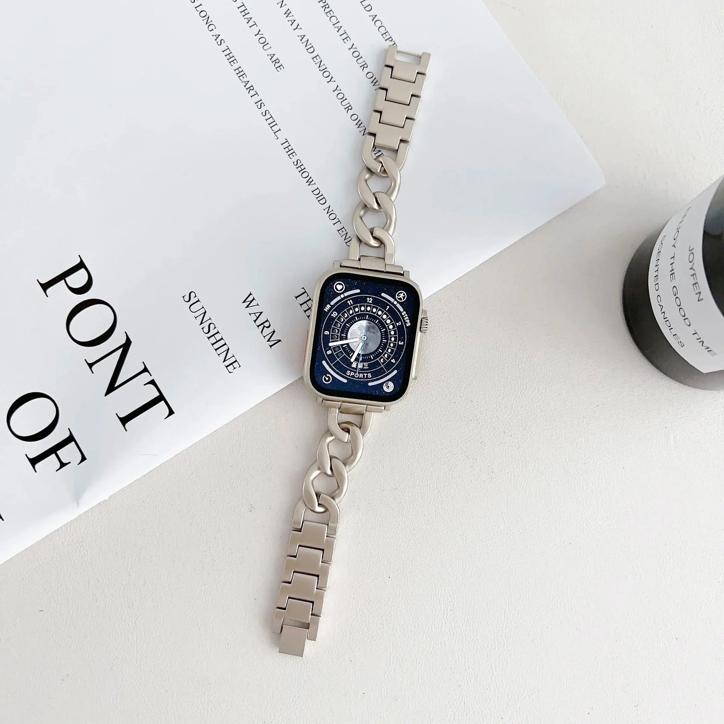Luxury Starlight Bracelet in stainless steel for Apple Watch, featuring a bold design and adjustable strap on a lifestyle setting.