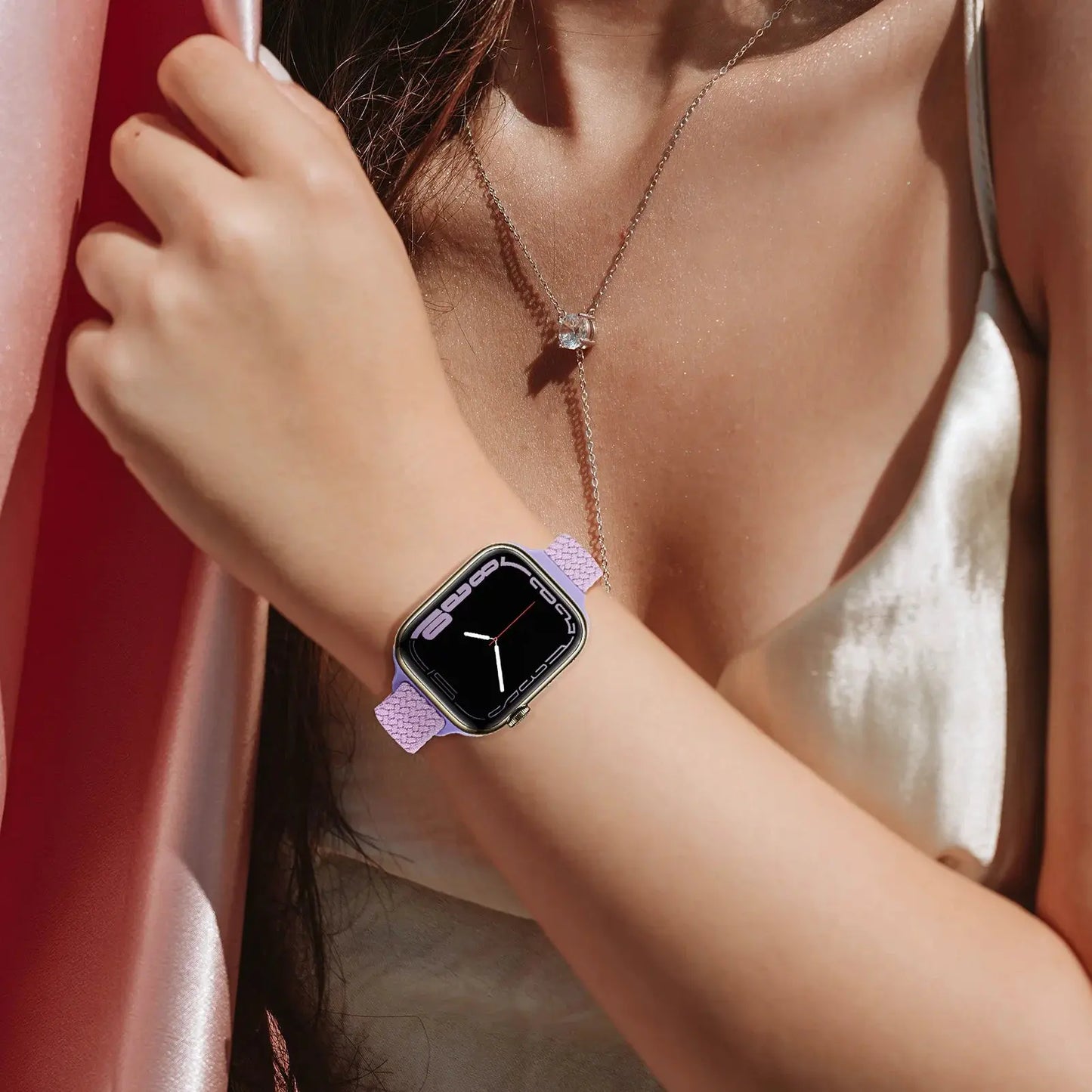 Adjustable slim braided solo loop watch band in lavender on a wrist, showcasing a stylish design and skin-friendly material.