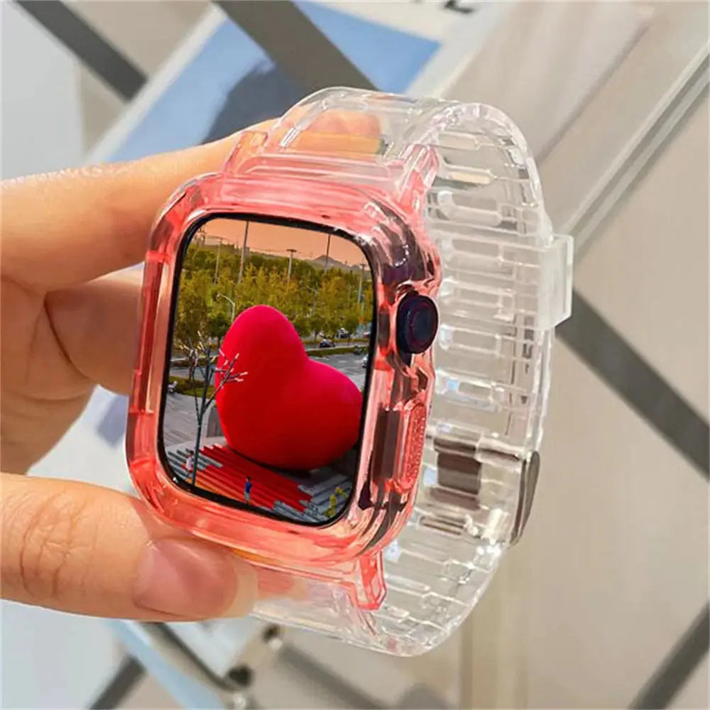 Cute transparent silicone Apple Watch band and case showcasing a heart-shaped statue in a park.