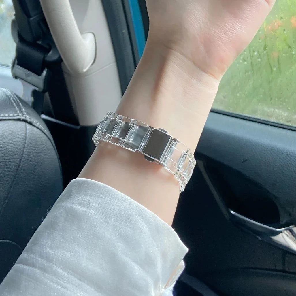 Clear Apple Watch Strap on wrist, showcasing stylish transparent acrylic design and butterfly clasp for a modern look.