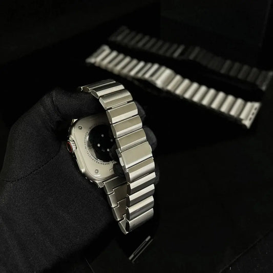 Close-up of a titanium bracelet for Apple Watch, showcasing durability and premium design in a stylish presentation.