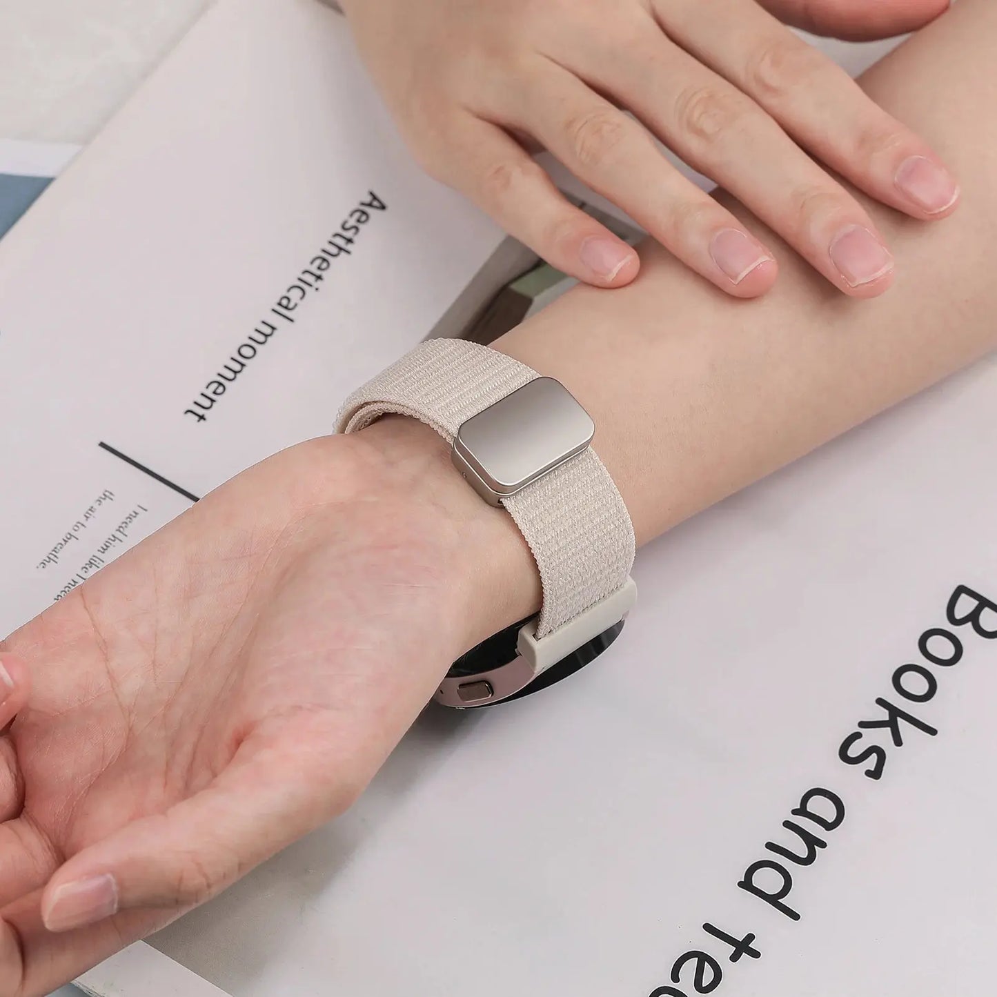 Hand wearing a stylish Magnetic Nylon Sports Band on a Samsung Galaxy Watch, showcasing comfortable and secure fit.
