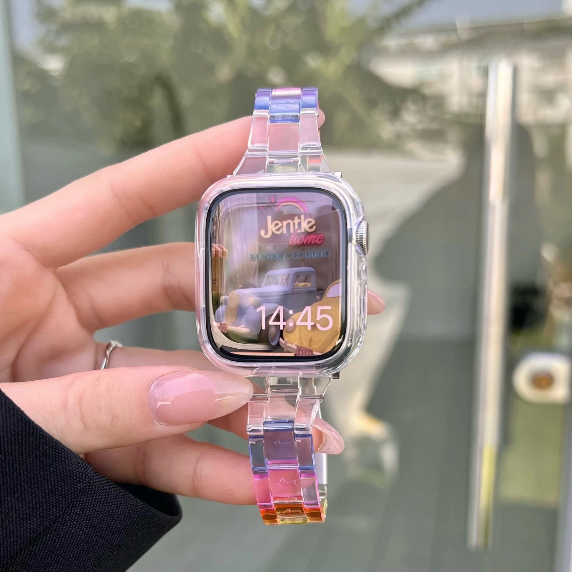 Clear Apple Watch strap showcasing a transparent acrylic design with vibrant colors, featuring a modern butterfly clasp.