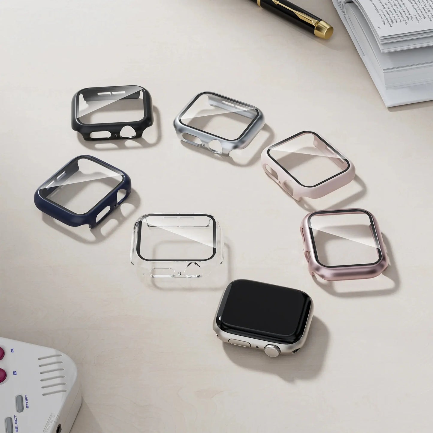 Collection of stylish HD glass and cases for Series 10 smartwatches in various colors on a desk.