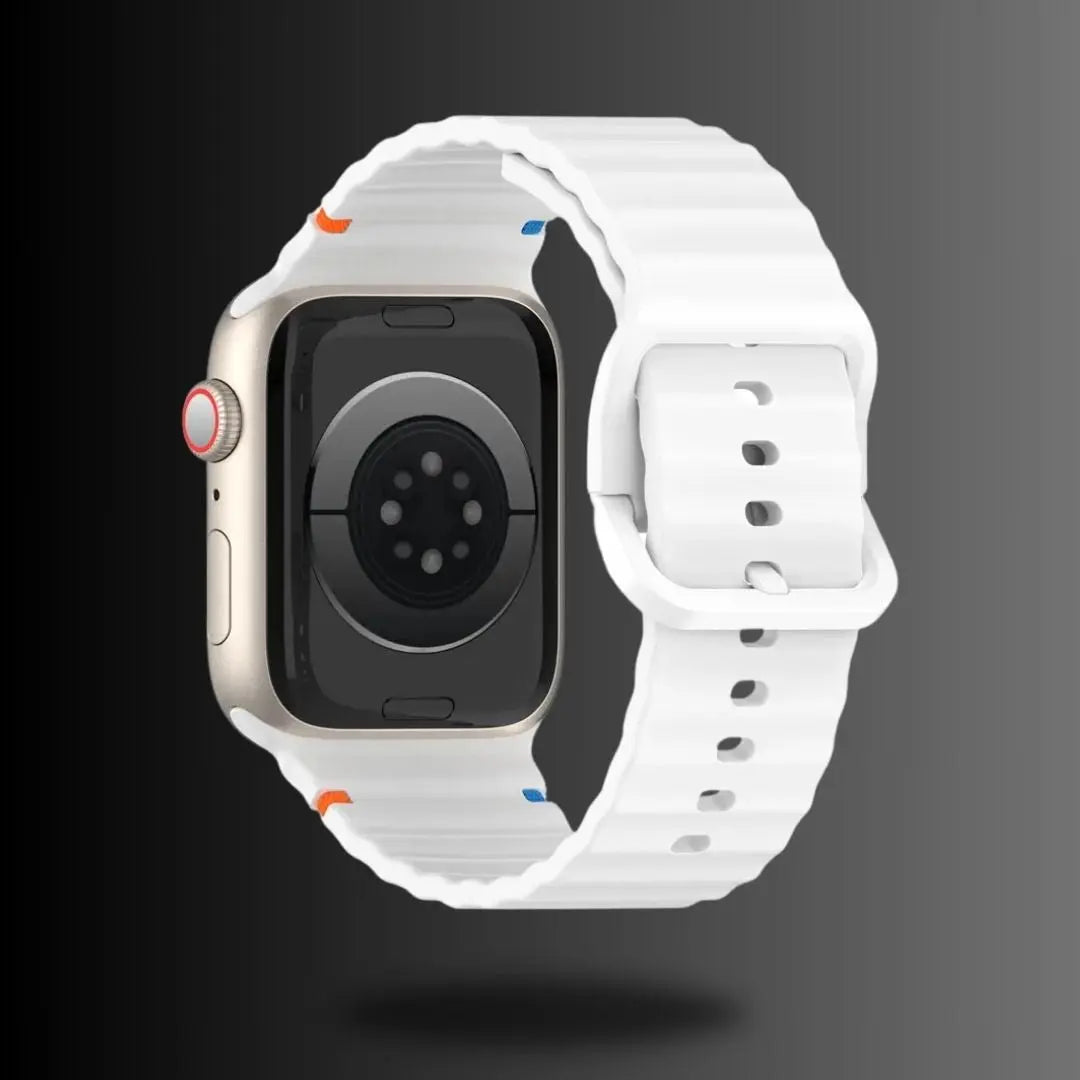 White silicone sport strap for Apple Watch, offering comfort and style for workouts and daily wear.