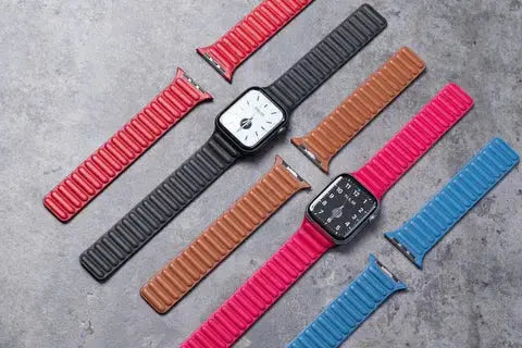 Leather Link Bands for Apple Watch in two-tone colors: pink, blue, black, and brown with stylish elastic design and comfortable fit.