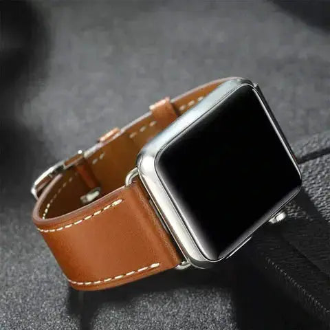 Classic single tour leather straps on an Apple Watch, featuring durable vegetable-tanned leather and stainless steel adapter.
