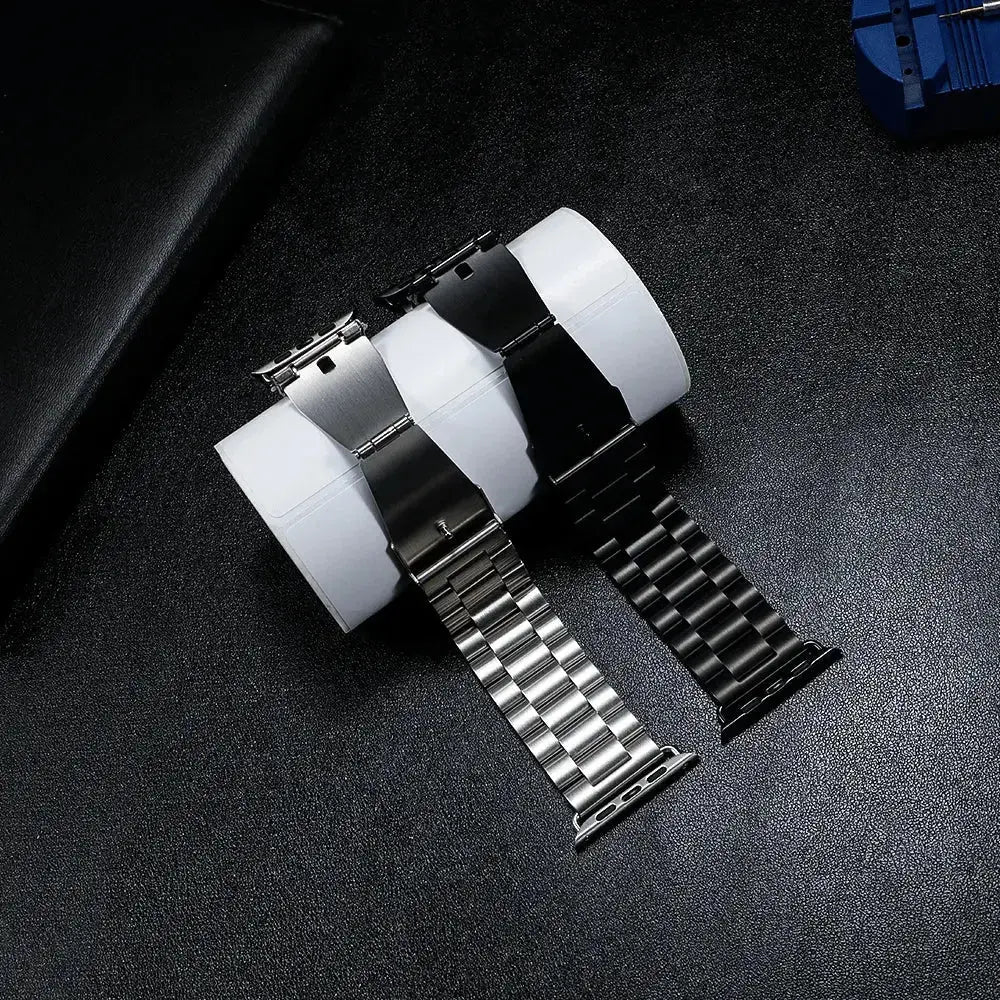 Classic stainless steel watch straps in silver and black on display, perfect for stylish occasions and comfortable wear.