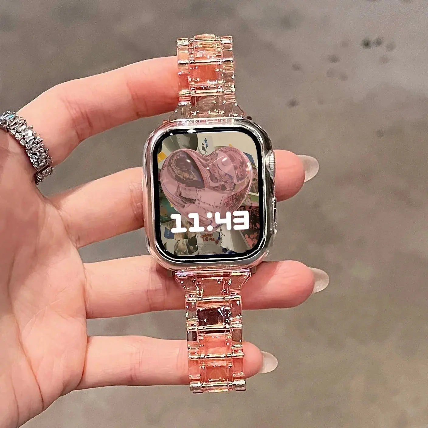 Clear Slim Apple Watch Bracelet on hand displaying time, highlighting its acrylic design and elegant clasp.