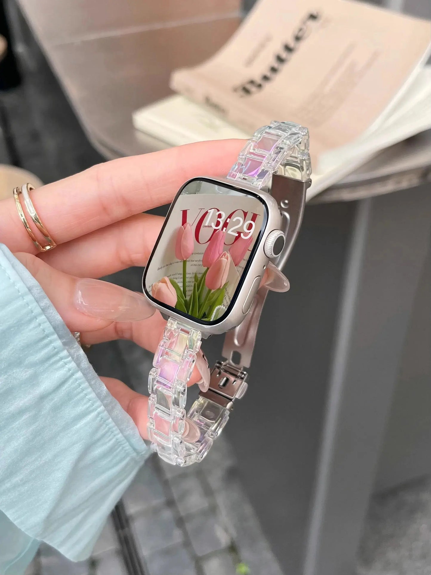 Clear Slim Acrylic Apple Watch Bracelet on wrist, showcasing a stylish transparent design with a secure clasp.