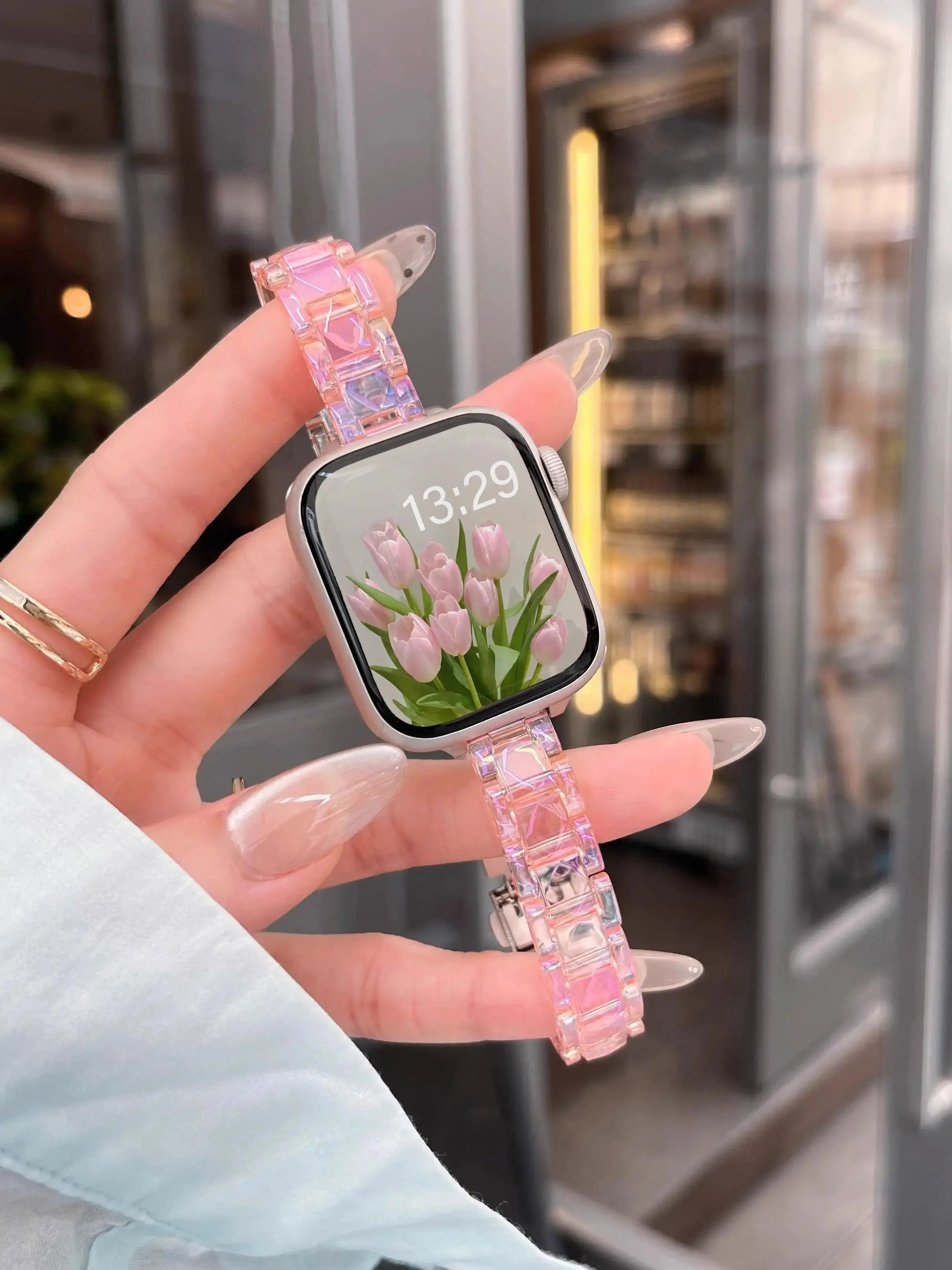 Clear Slim Acrylic Apple Watch Bracelet in hand, showcasing elegant design and comfortable fit for everyday style.
