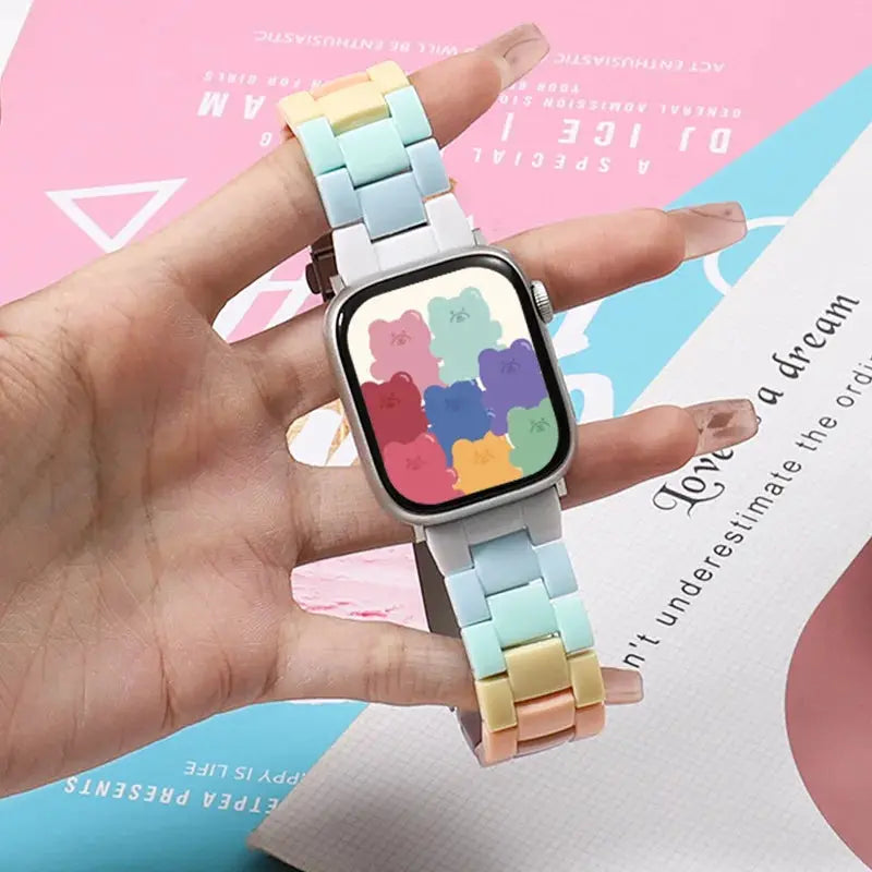 Clear Slim Acrylic Apple Watch Bracelet in pastel colors, showcasing a playful design on the watch face.