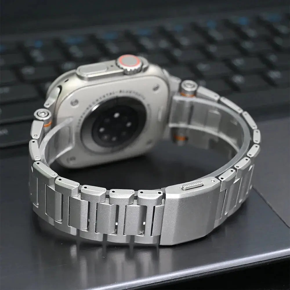 Cowboy metallic watch band on Apple Watch, showcasing durable 316L stainless steel and adjustable link design.