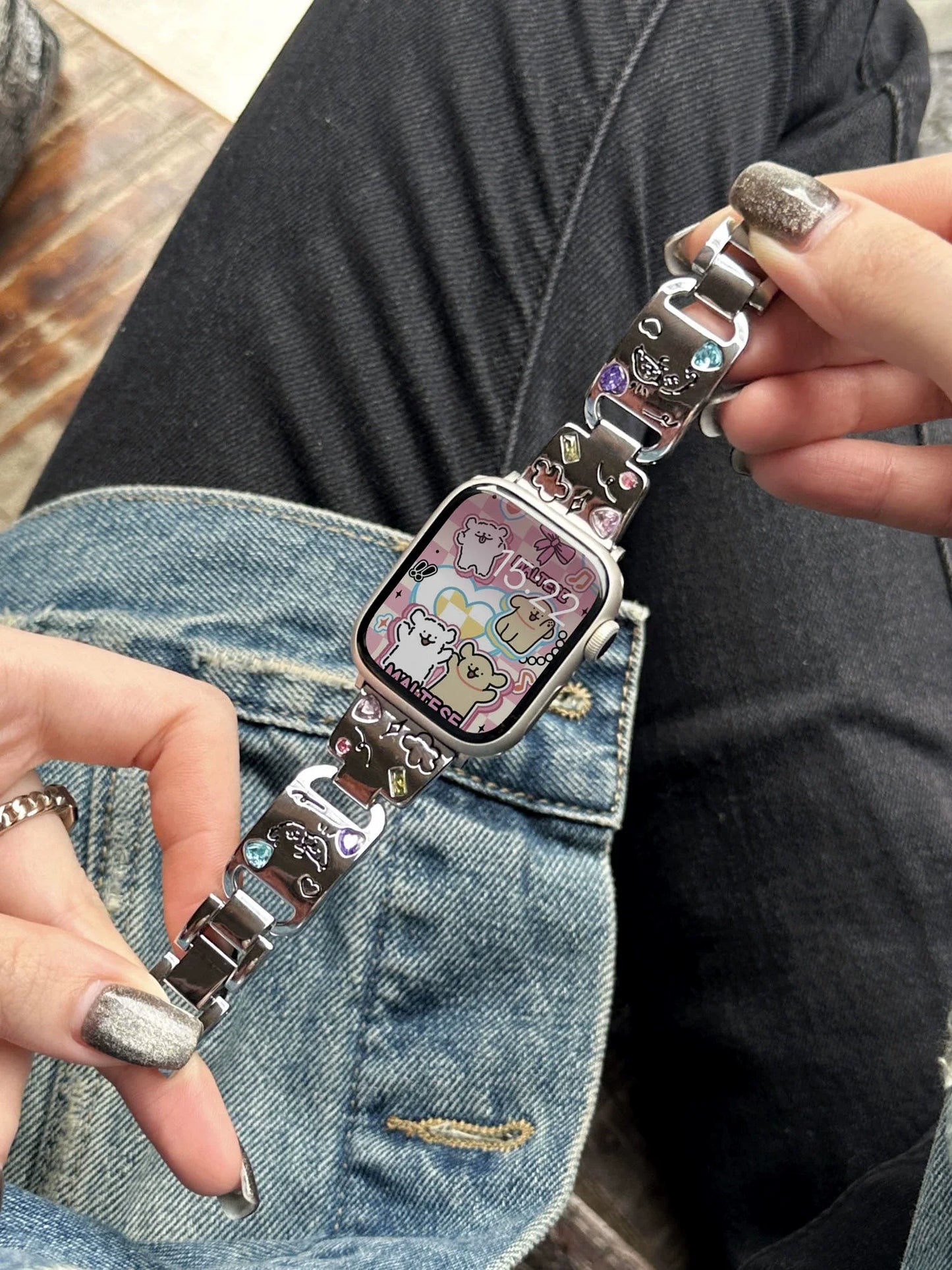 Cute Cat Jewelry Apple Watch Band – Glossy Metal Bracelet worn on wrist, showcasing colorful gem accents and cat designs.