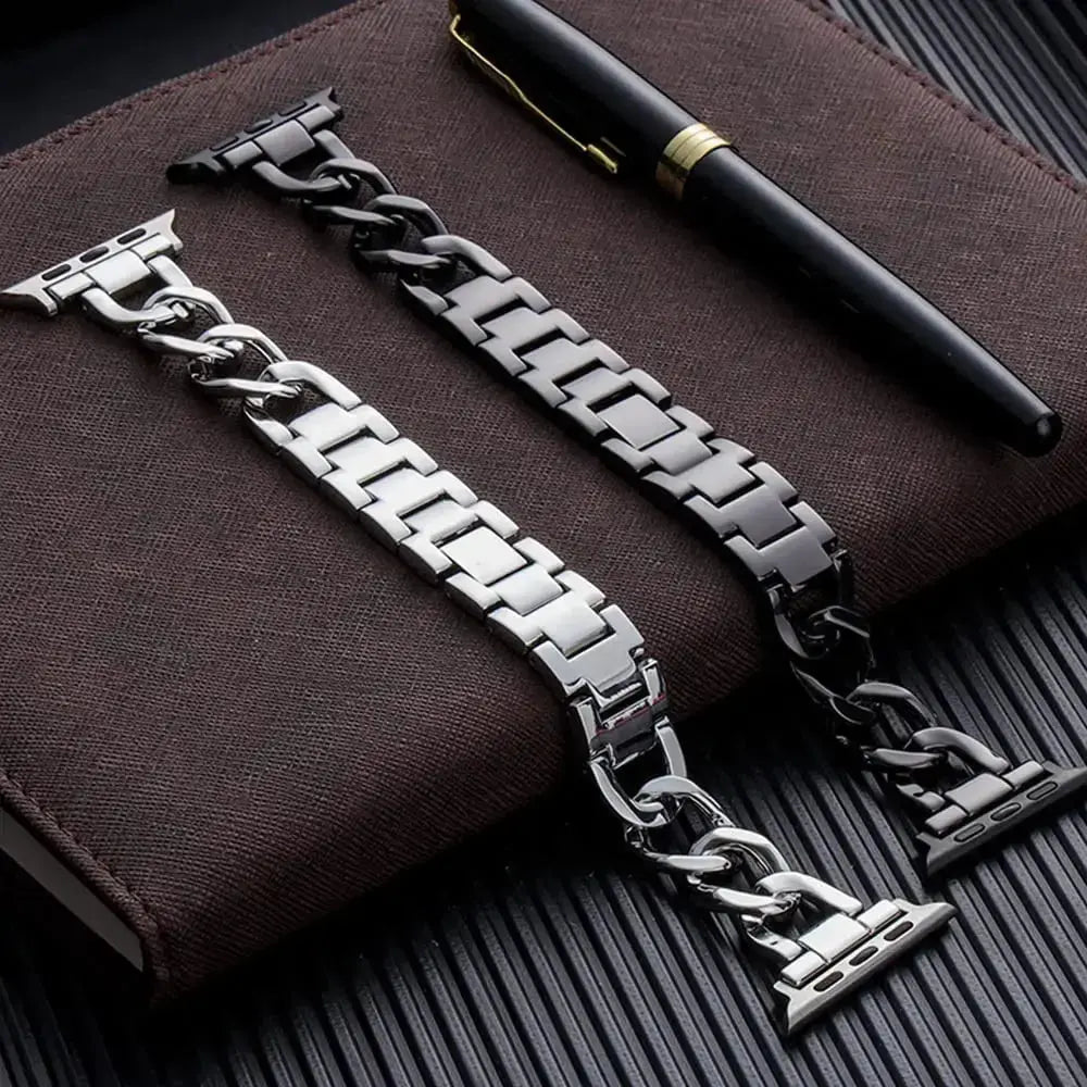 Luxury Cuban bracelet in stainless steel with chunky chain design, paired with a pen on a stylish notebook.