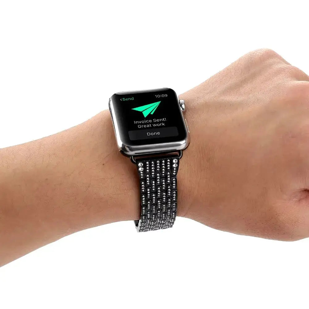 Luxury jewelry bracelet on wrist with Apple Watch Ultra, showcasing a stylish stainless steel and CZ stone design.