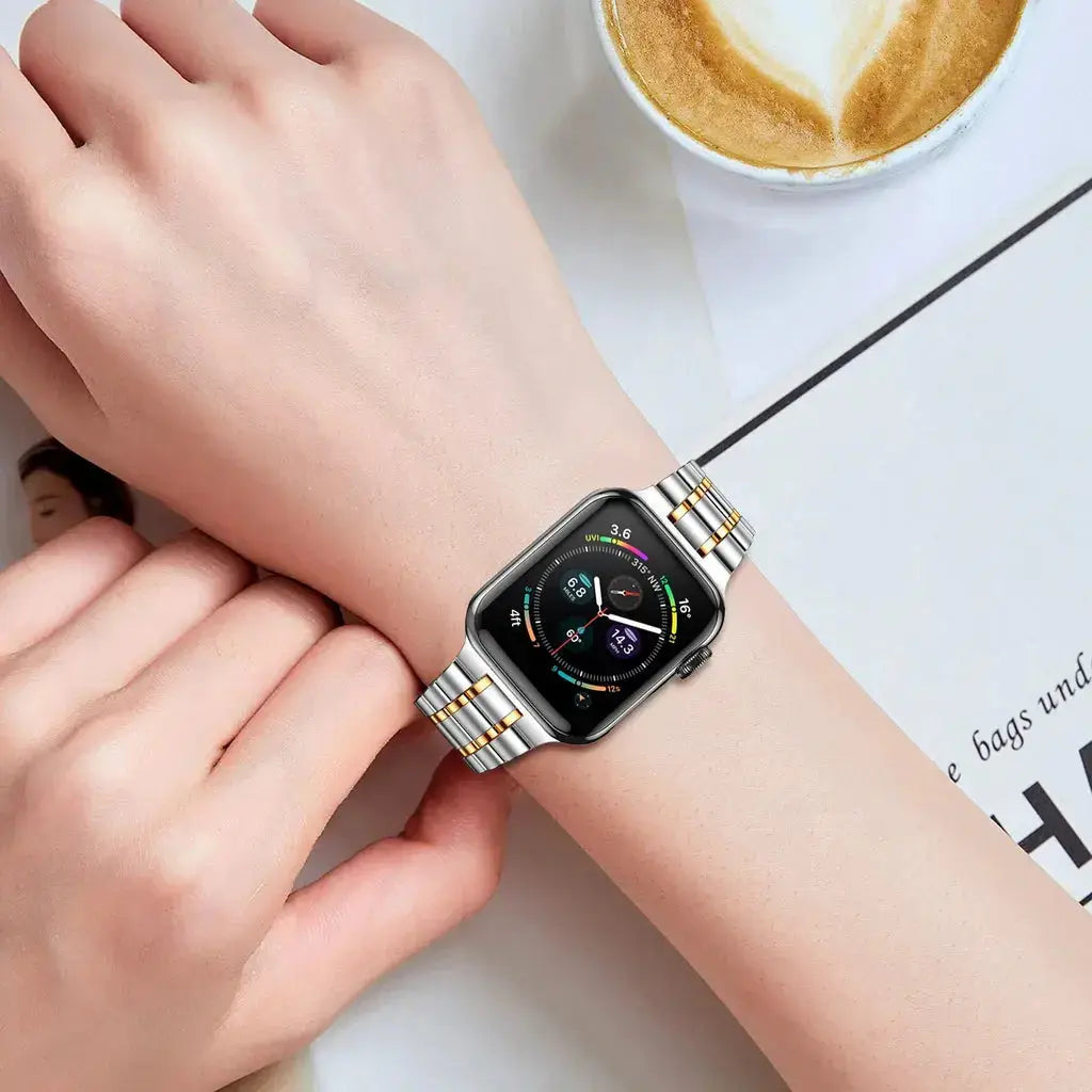 Modern stainless steel link bracelet on wrist with Apple Watch, showcasing elegance and functionality.