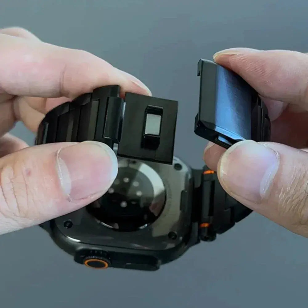 Hands demonstrating the magnetic clasp of the Cowboy stainless steel Apple Watch band, showcasing easy wear and adjustable size.