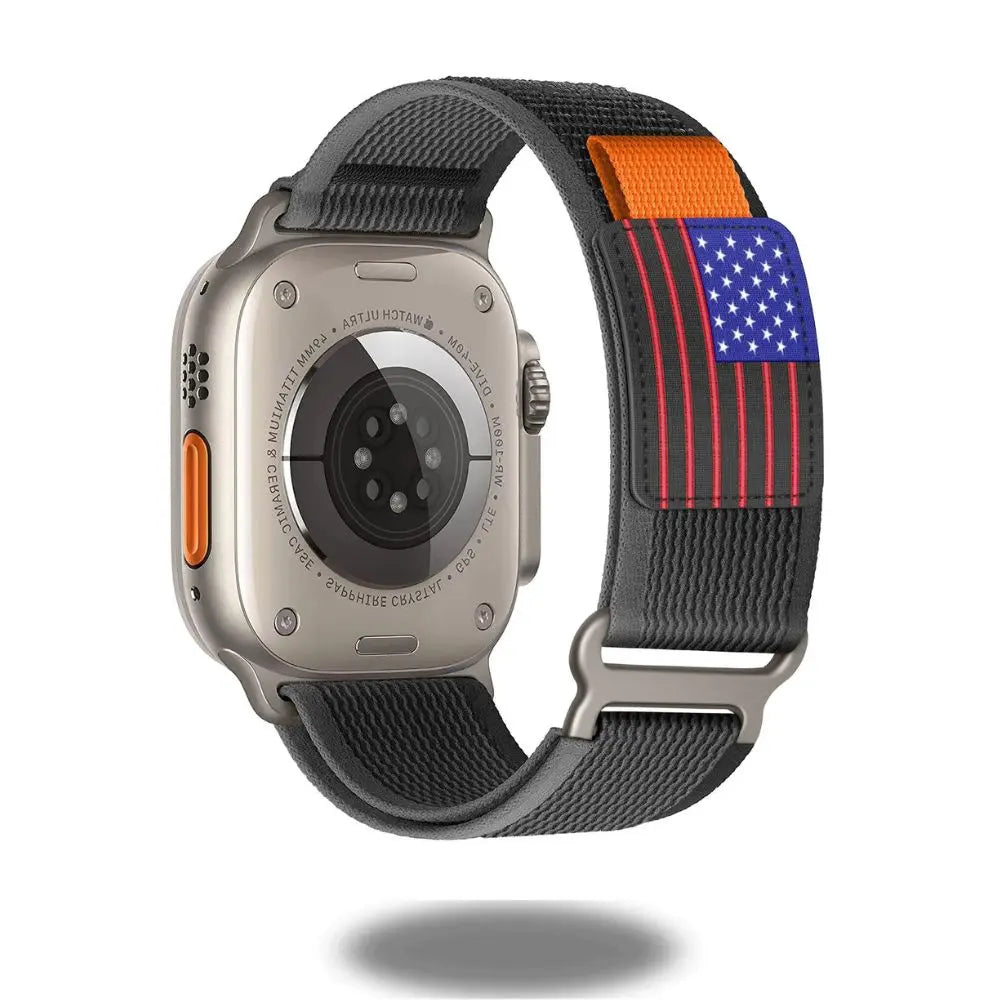 Stylish Travel Loop for Apple Watch with sporty design and adjustable stainless steel band, featuring American flag accents.