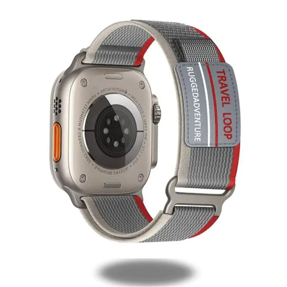 Travel Loop for Apple Watch in gray and red, featuring adjustable stainless steel and sporty design for adventurers.