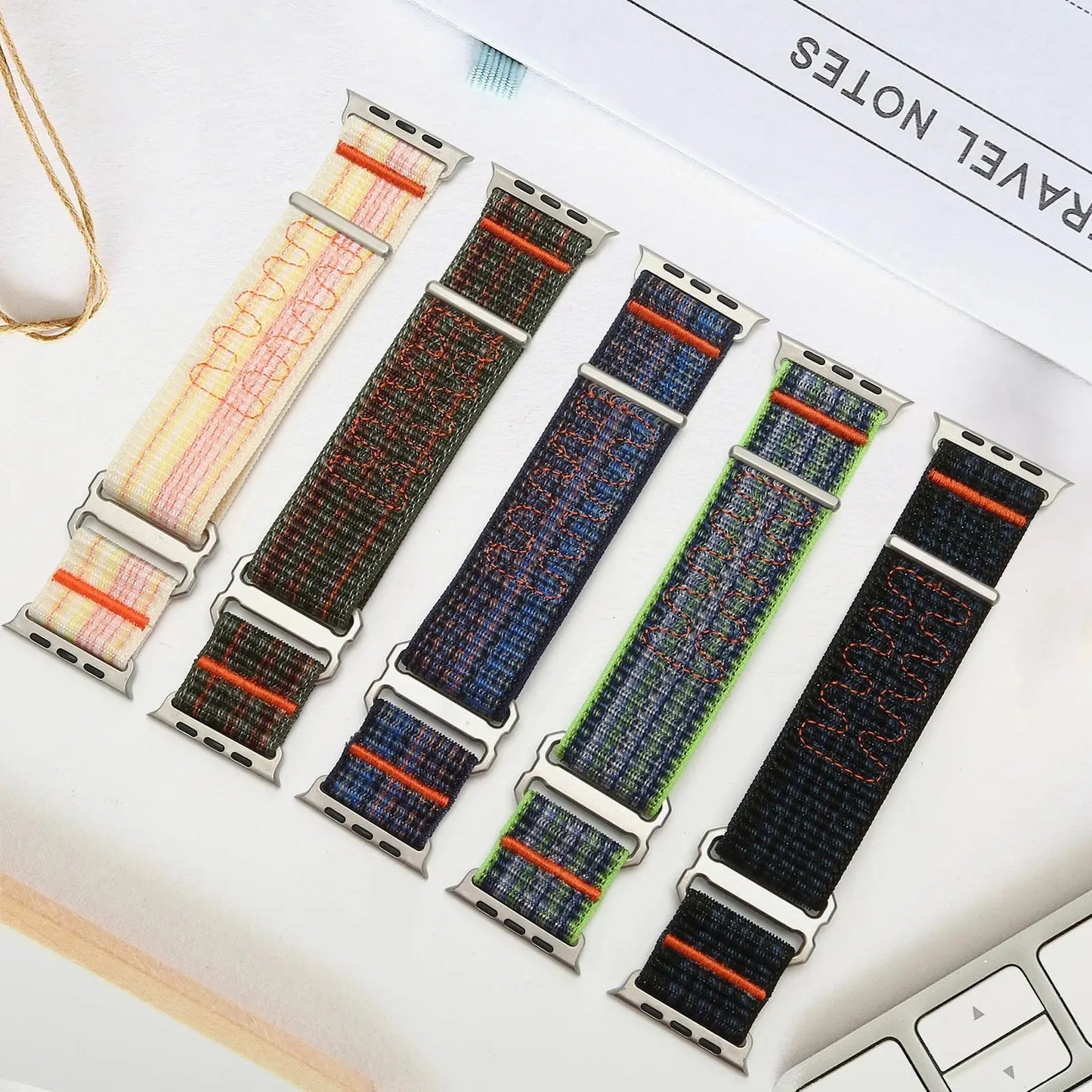 Colorful upgraded sport loop bands for Apple Watch, showcasing various styles and designs, made from durable nylon material.
