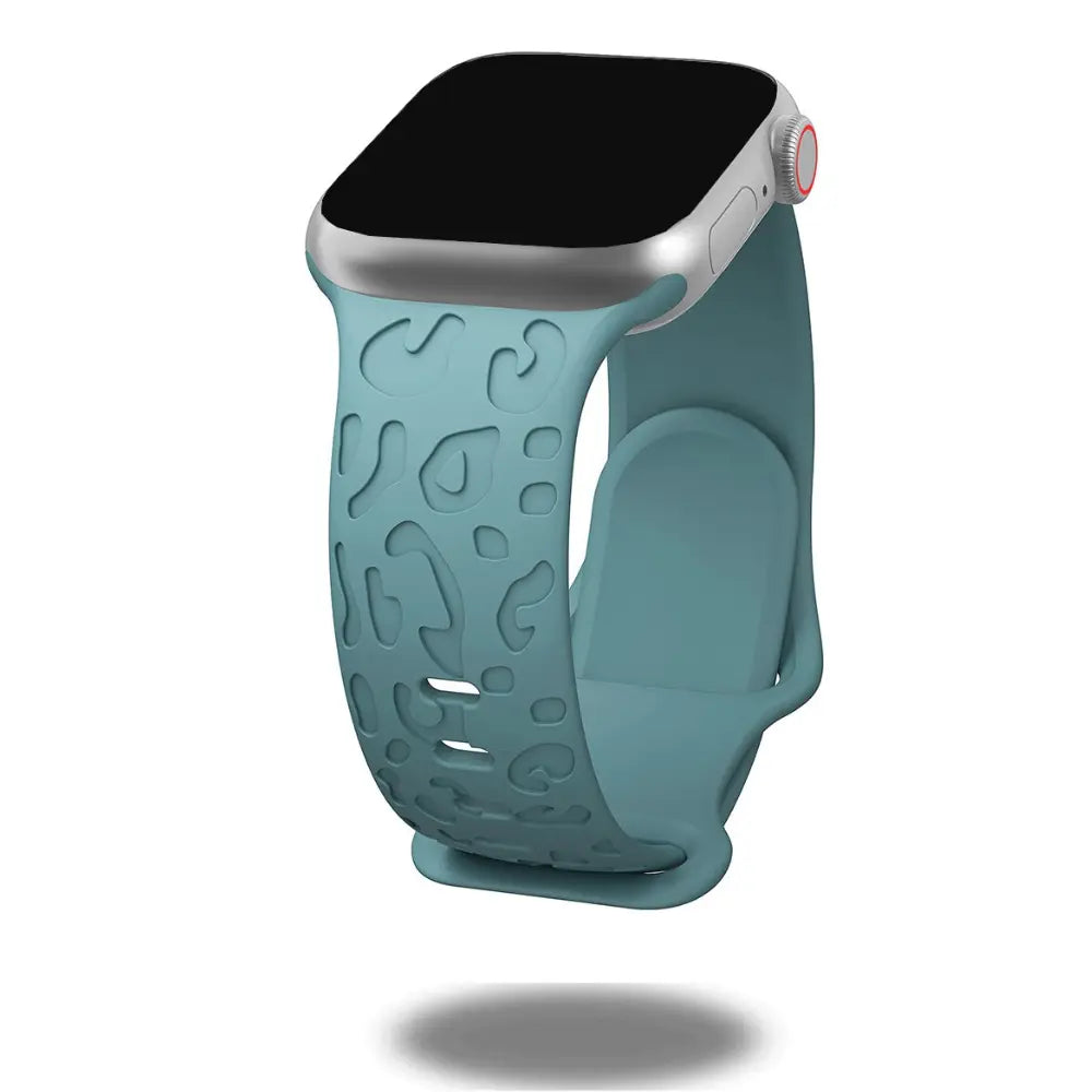 Engraved leopard's paws silicone band for Apple Watch, stylish and comfortable wrist accessory in teal.