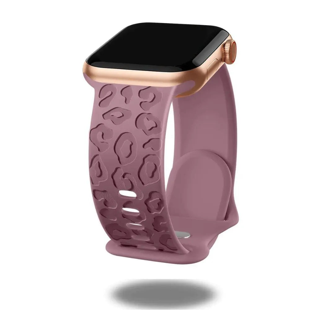 Engraved leopard's paws silicon band for Apple Watch in mauve, stylish and comfortable for daily wear.