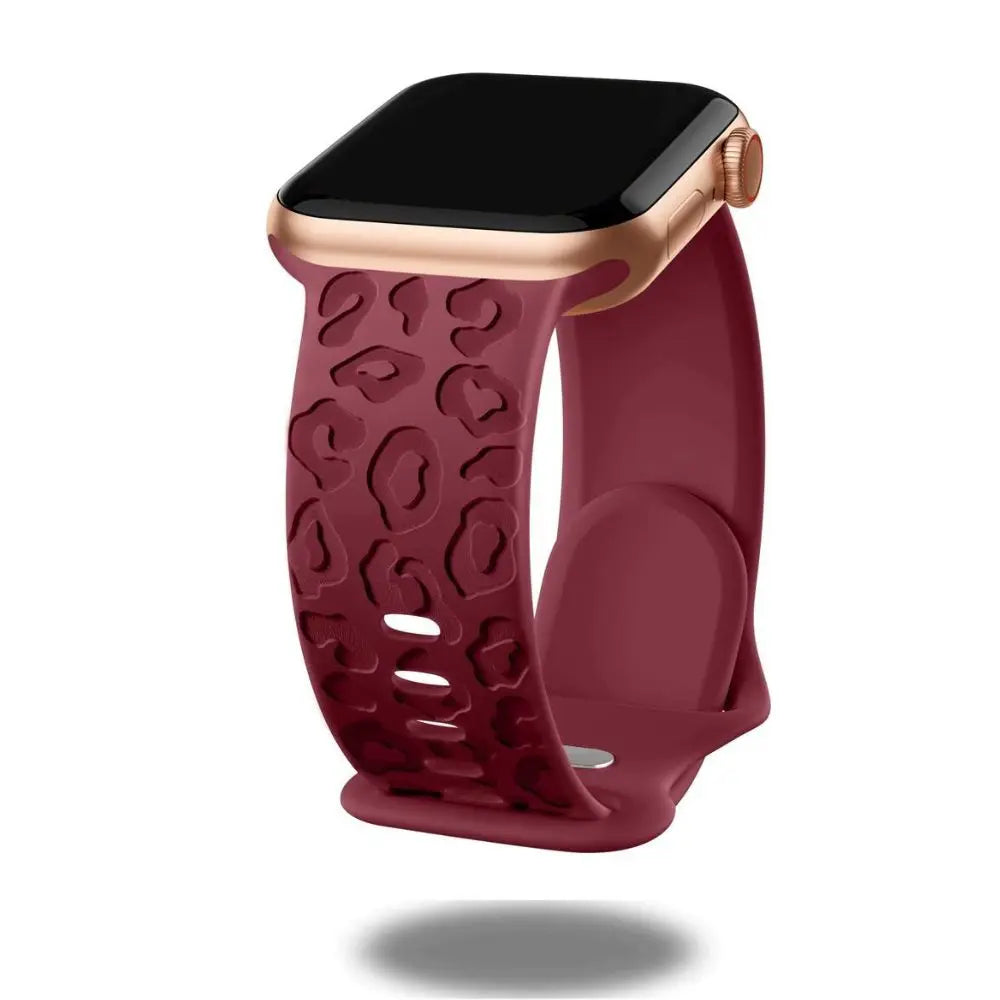 Engraved leopard's paws silicon band for Apple Watch showcasing stylish and comfortable design in burgundy color.