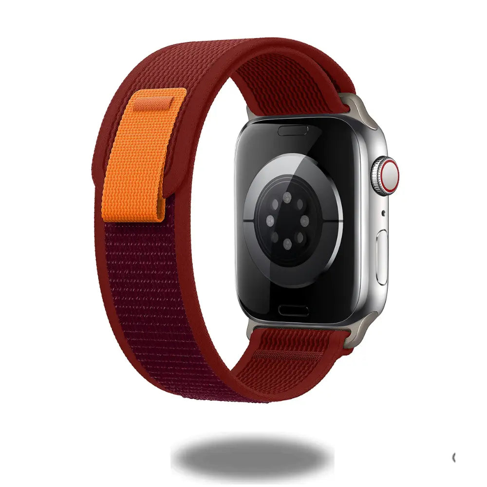 Trail Loop Bands for Apple Watch in red and orange, lightweight, breathable nylon weave for comfort and quick adjustments.