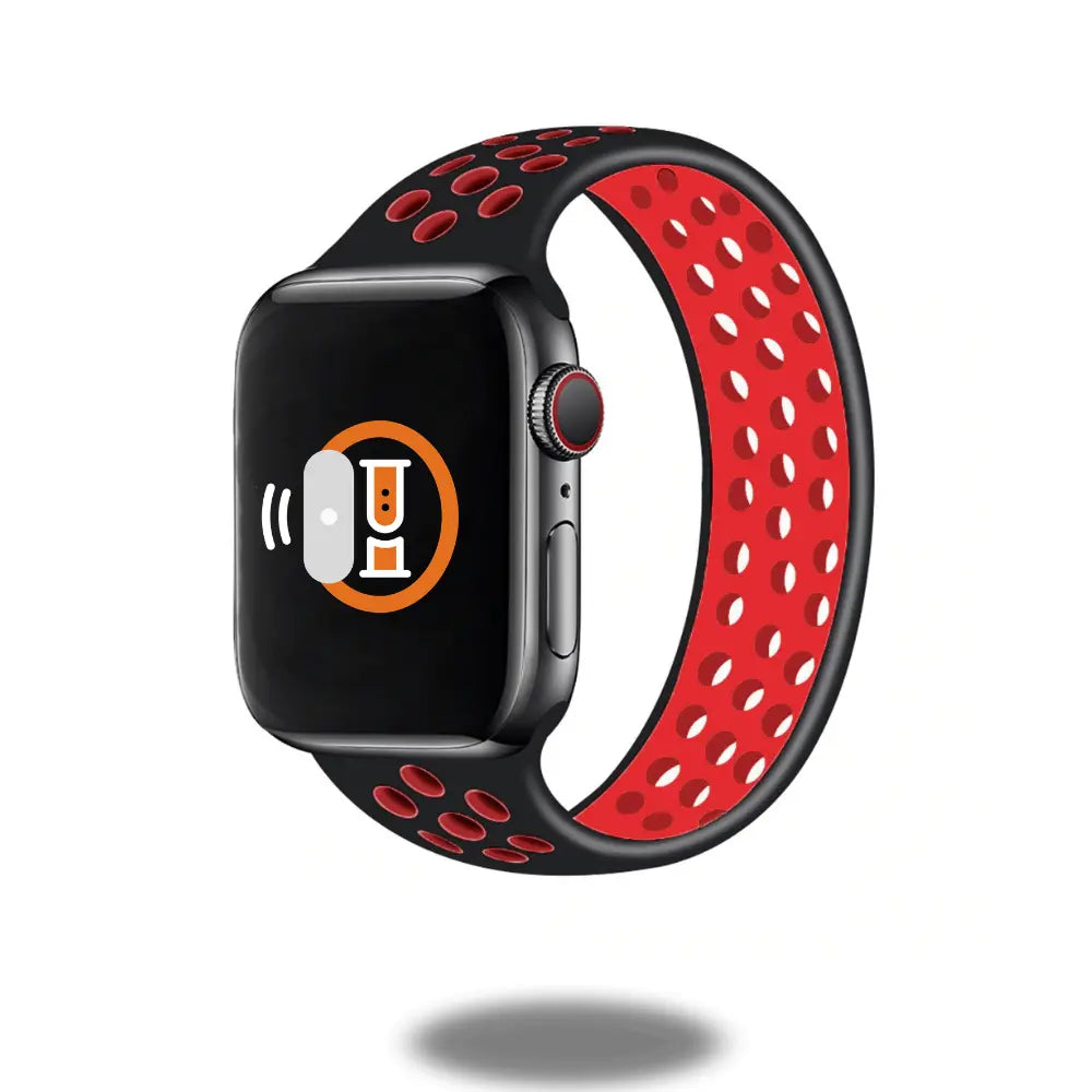 Apple Watch with sporty black and red silicone loop band, designed for comfort and style, perfect for workouts and water activities.