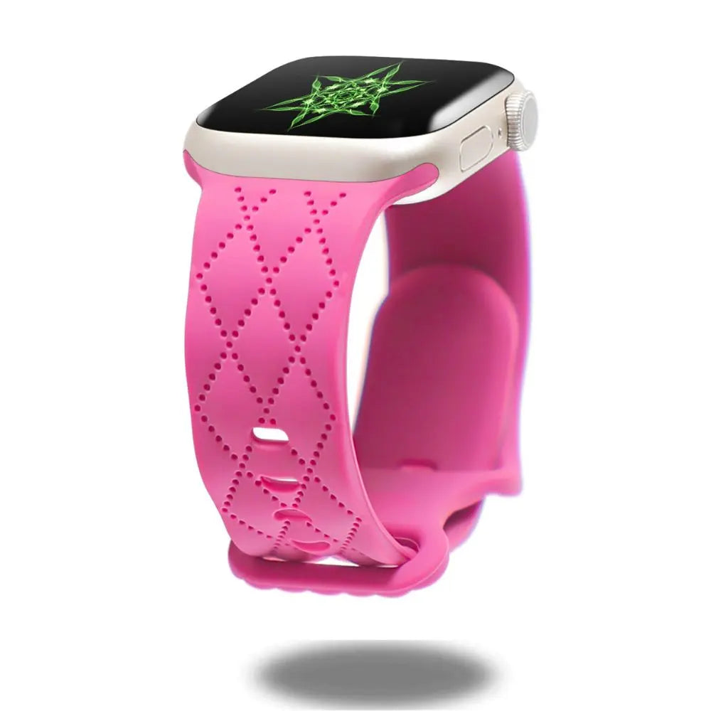 Modern pink silicon sports band for Apple Watch, featuring a double clasp design and stylish ventilation.