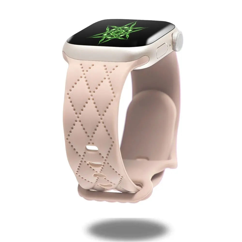 Modern silicon sports band for Apple Watch in a pale pink color, featuring a stylish double clasp design.